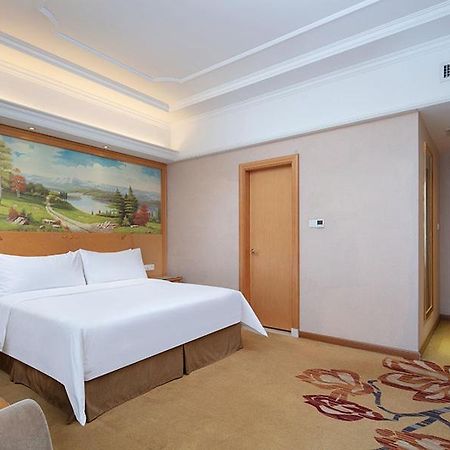 Vienna International Hotel Jiujiang Shili Street Bagian luar foto