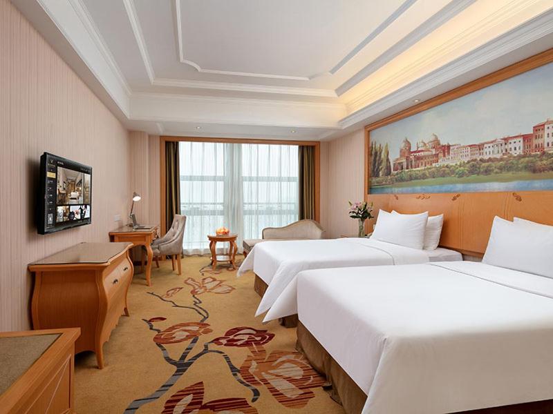 Vienna International Hotel Jiujiang Shili Street Bagian luar foto