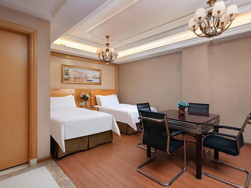 Vienna International Hotel Jiujiang Shili Street Bagian luar foto