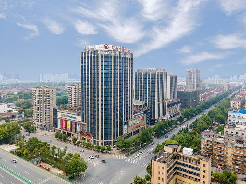 Vienna International Hotel Jiujiang Shili Street Bagian luar foto